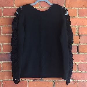 Kelly Bergin slashed sweater